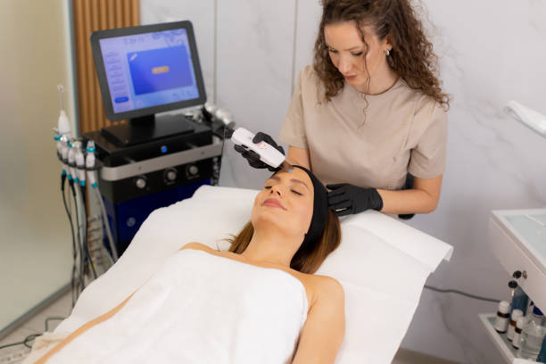 istock Relaxing facial cleansing experience with ultrasonic massager in a serene spa setting 2195246767