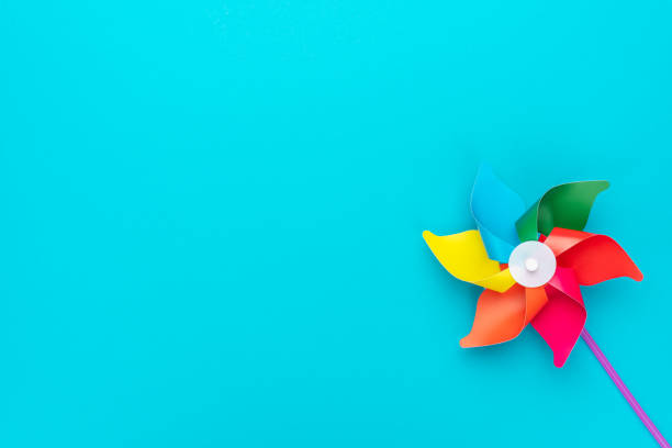 istock Pinwheel on turquoise blue background 2195246899