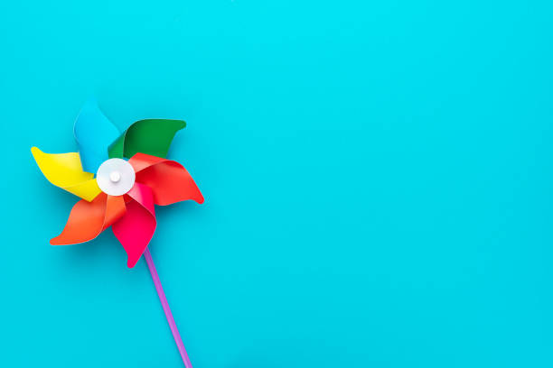 istock Pinwheel on turquoise blue background 2195246959