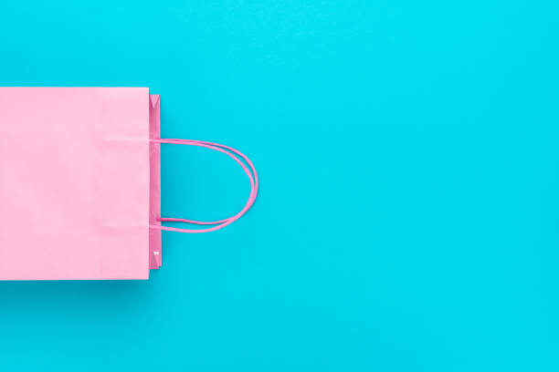 istock Shopping paper bag on blue background with copy space 2195247069