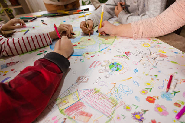 istock Creative Kids and Teacher Draw Earth Day Poster 2195247179