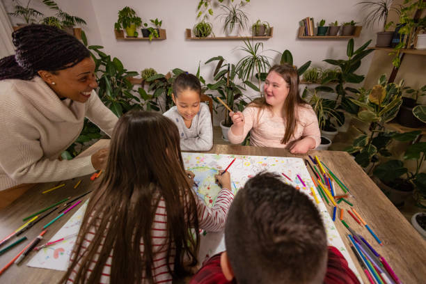 istock Teacher and Kids Working on Earth Day Poster 2195247551