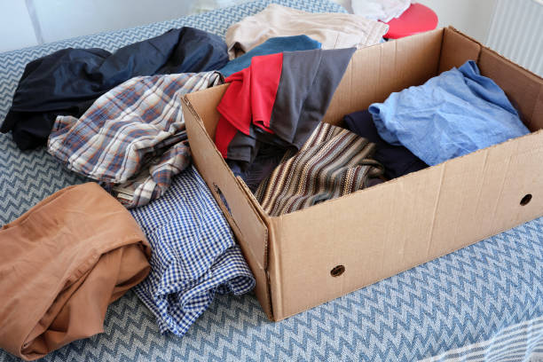 istock Cardboard box with old clothes. Donation concepts. 2195249268