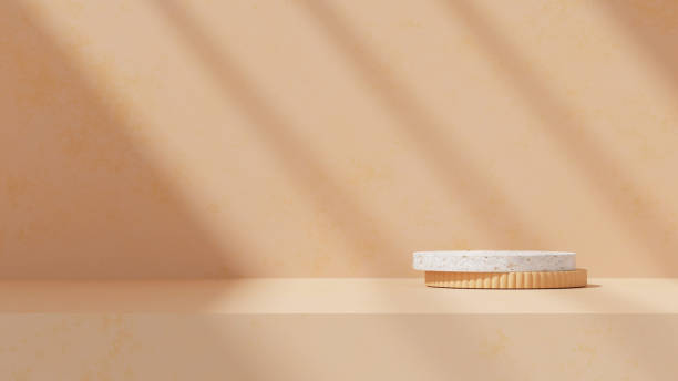 istock An empty scene featuring product display stands along with a podium, set against a orange background with soft, subtle shadows in a landscape orientation 2195249358