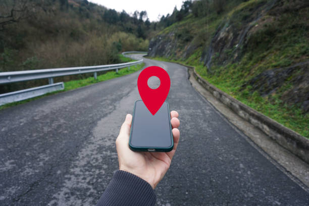 istock hand holding a smart phone searching location, with a gps symbol 2195257486