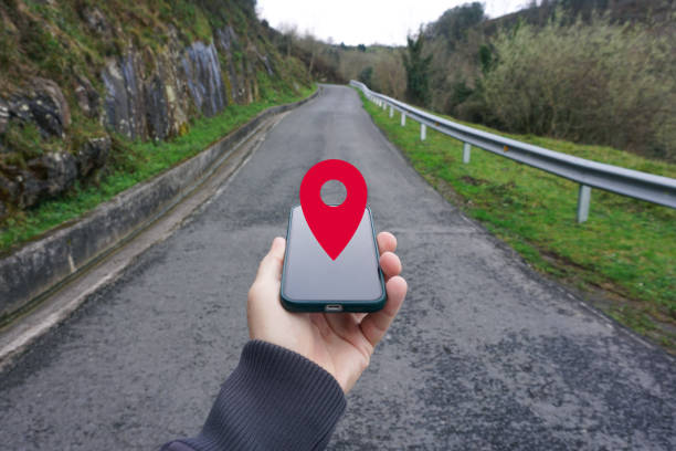 istock hand holding a smart phone searching location, with a gps symbol 2195257487