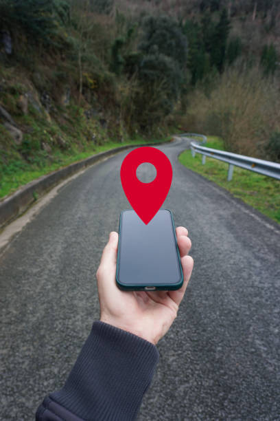 istock hand holding a smart phone searching location, with a gps symbol 2195257489