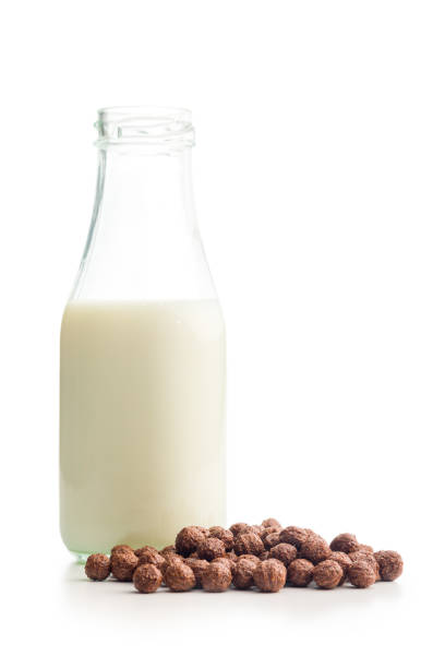 Breakfast cereal chocolate balls and milk isolated on a white backgorund.