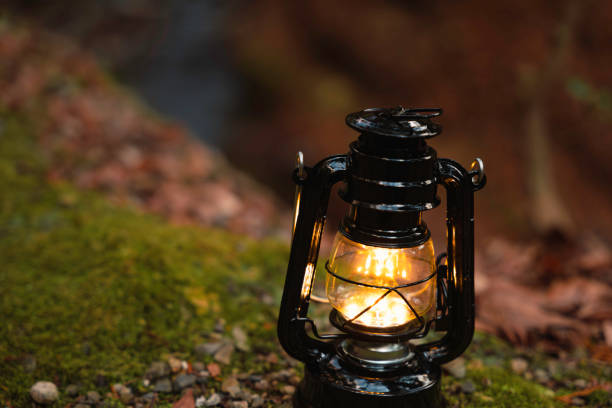 istock By the riverbank, lit lanterns, autumn camp 2195257901