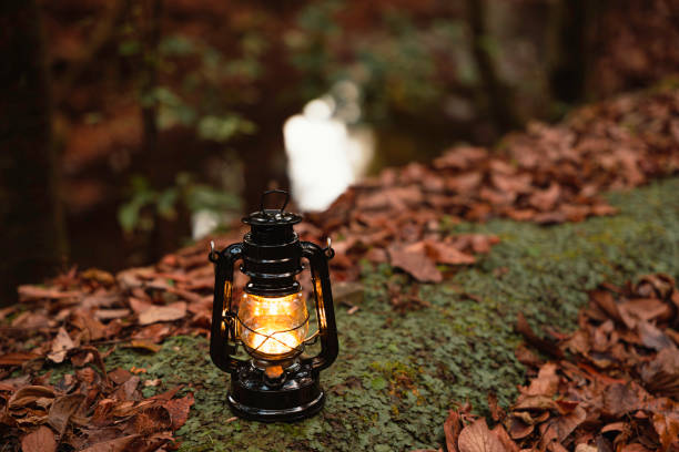 istock By the riverbank, lit lanterns, autumn camp 2195257964