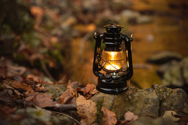 istock By the riverbank, lit lanterns, autumn camp 2195258100