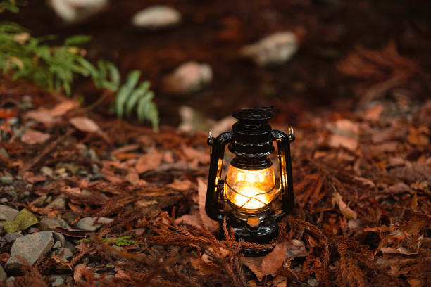 istock By the riverbank, lit lanterns, autumn camp 2195258125
