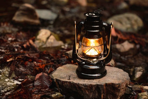 istock By the riverbank, lit lanterns, autumn camp 2195258295