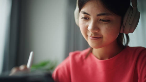 istock Teenager working on digital tablet. 2195259041