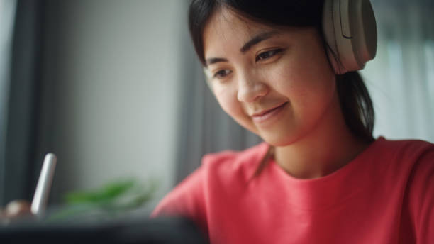 istock Teenager working on digital tablet. 2195259089
