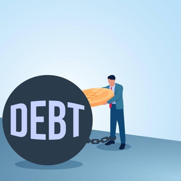 istock A man puts coins into a piggy bank of debt that chains him. Illustration for paying debts, paying off loans and being debt free. 2195259613
