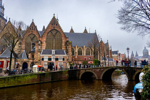 istock A captivating view of the historic Oude Kerk (Old Church) in Amsterdam, featuring its Gothic architecture and large stained-glass windows 2195260027