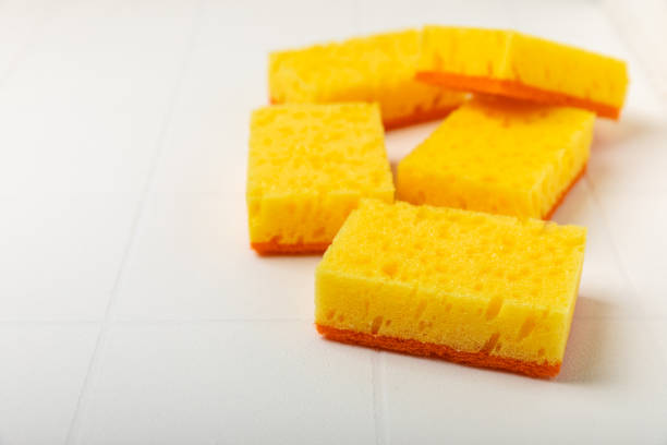 istock Colorful dish sponges on textured background. Kitchen sponge. Cleaning concept, cleaning service. Dishwashing liquid with clean and dirty dishes plate. Place for text, copy space. Wash the dishes. 2195260214
