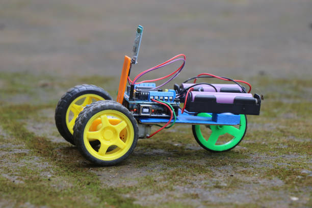 istock Robotic car which is a working prototype that is controlled via smart phone and bluetooth uses programmable controller 2195262742