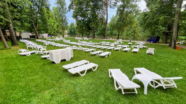 istock A large lawn with many white lawn chairs and a few benches 2195265922
