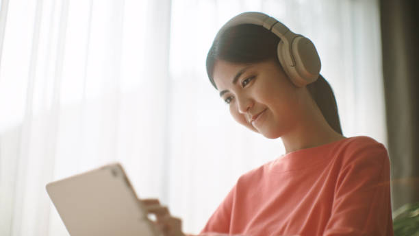 istock Young woman relax with digital tablet. 2195266258