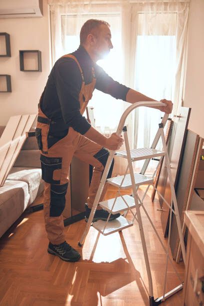 istock Carpenter working and assembling furniture in a new apartment. 2195267158