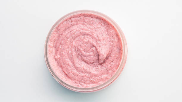 istock A small pink jar of cream sits on a white background 2195274948