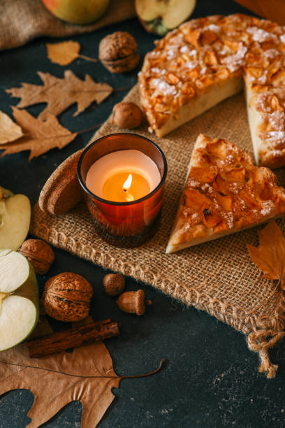 istock Candle and homemade apple pie, autumn mood 2195280603
