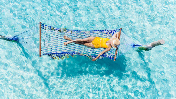 istock Relaxation under the sun on a hammock in Koh Kood's clear turquoise waters 2195281193
