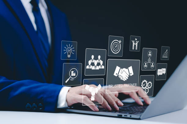 istock Trusted Partner and Collaboration Concept. Businessman using a laptop with icons trust, partnership, and collaboration. teamwork, reliability, and value of trusted business relationships. Trustworthy, 2195282215