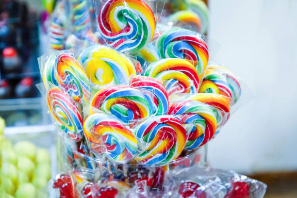 istock round flat colored striped lollipops wrapped in transparent film 2195282436