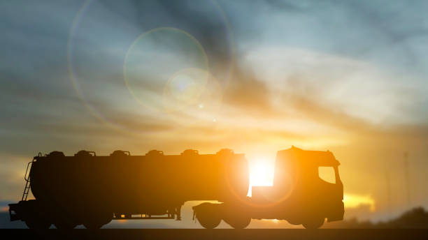istock Long oil truck deliver transportation sunset background 2195283666