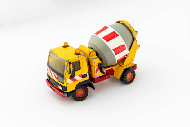 side view of toy tow truck  against red background.