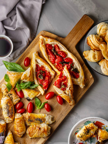 istock Turkish pita. Turkish Pide. Margherita Flat Bread Pizza. Turkish pide with pastry on the board. Homemade feta cheese puff pastry. Puff pastry pie with tomatoes and basil. Savory Tarts. Tomato Quiche. Tomato Tart. Delicious fresh cheese pita. 2195283792