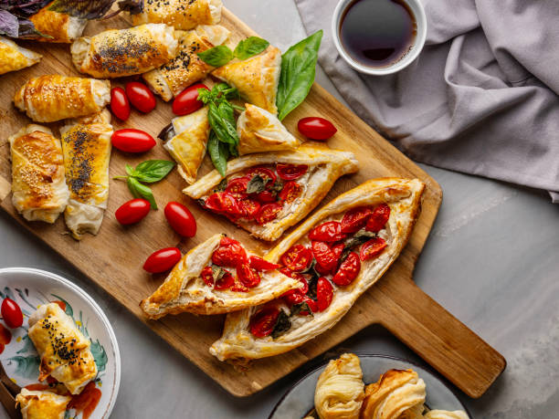 istock Turkish pita. Turkish Pide. Margherita Flat Bread Pizza. Turkish pide with pastry on the board. Homemade feta cheese puff pastry. Puff pastry pie with tomatoes and basil. Savory Tarts. Tomato Quiche. Tomato Tart. Delicious fresh cheese pita. 2195285360