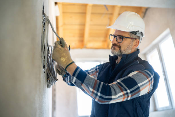 istock Electrician Installing Wires in a House Under Renovation 2195286230