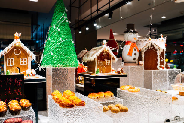 A charming bakery window showcases a variety of baked goods, adorned with festive decorations and a snow-dusted wreath. Warm lights twinkle softly, creating a cozy holiday atmosphere.