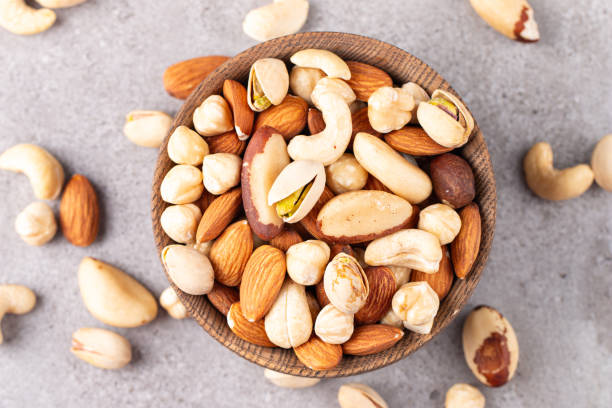 istock Healthy mix nuts. Almonds, hazelnuts, cashews, peanuts, pistachios, Brazil nuts 2195286850