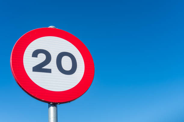istock twenty kilometers per hour speed limit sign with blue sky background, background traffic concept 2195288361