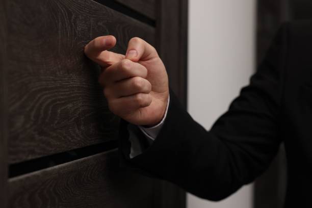 istock Collector knocking on door indoors, closeup view 2195288418