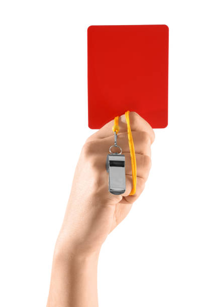 Metal whistle with a yellow cord on a white background.