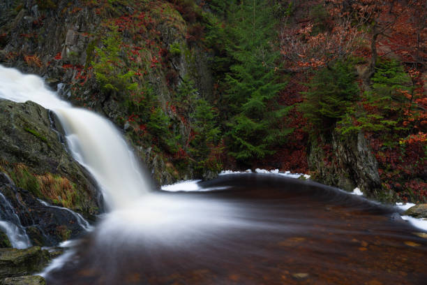 Waterfall Cascade du Bayehon during fall in the Belgian Ardennes near Malmedy. There is a lovely motion in the water.