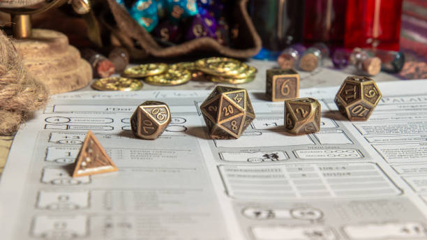 istock Brass RPG Dice On Character Sheet With Coins And Props 2195290859