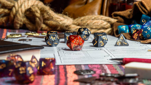 istock Table top view of Roleplaying Game Dice And Character Sheets 2195290904