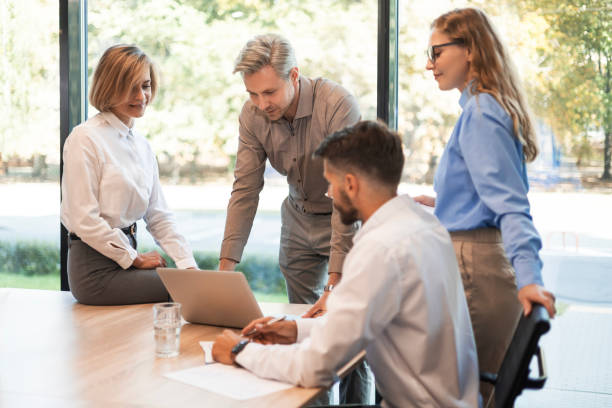 istock Business team discussing together business plans in office. 2195290942