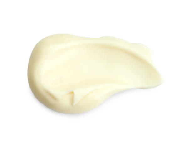 istock Tasty fresh mayonnaise sauce isolated on white, top view 2195295235