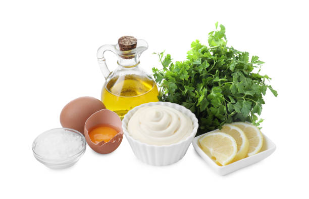 istock Fresh mayonnaise sauce in bowl and ingredients on white background 2195295310