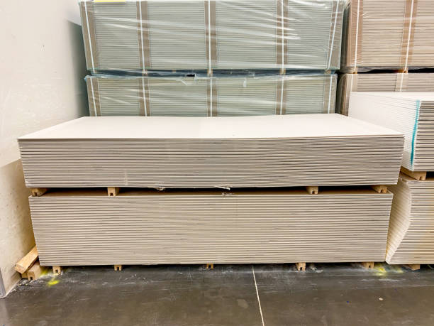 istock A carefully stacked arrangement of drywall sheets forms a robust and sturdy structure, which is constructed from this essential and widely utilized building material known in the industry 2195297074