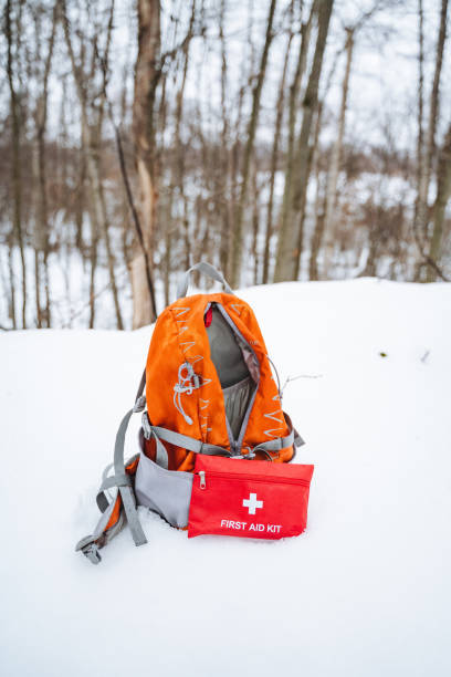 istock A bright backpack and a wellequipped first aid kit are sitting on the cold, white snow, creating a stark contrast in this wintery landscape, as if waiting for their owner to return 2195297077