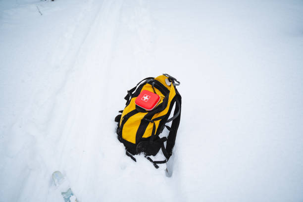 istock A vibrant yellow backpack containing a bright red ball is resting peacefully in the glistening white snow, creating a striking contrast against the frosty winter landscape 2195297126
